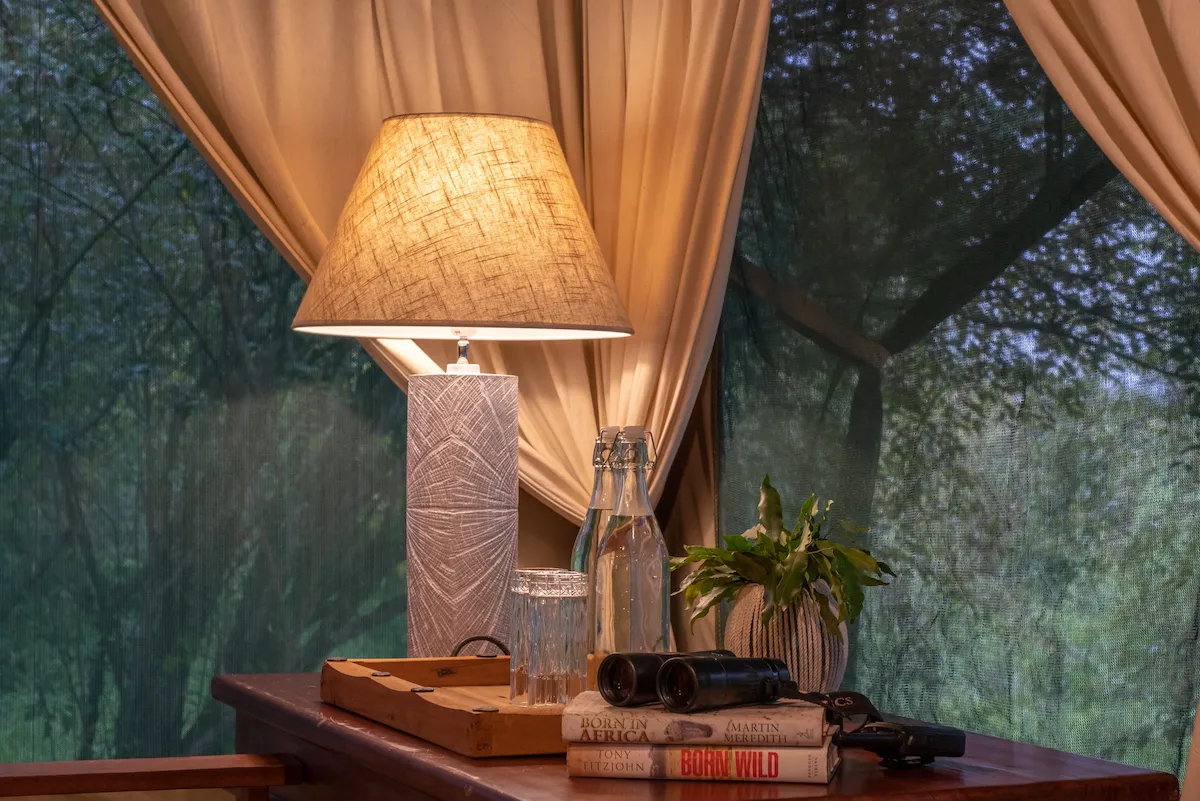 Private tent deck with lanterns facing the Olare Orok River