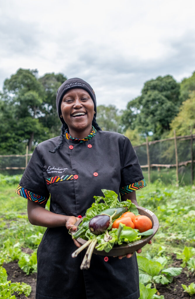 Chef harvesting at in-house garden at Enkakenya